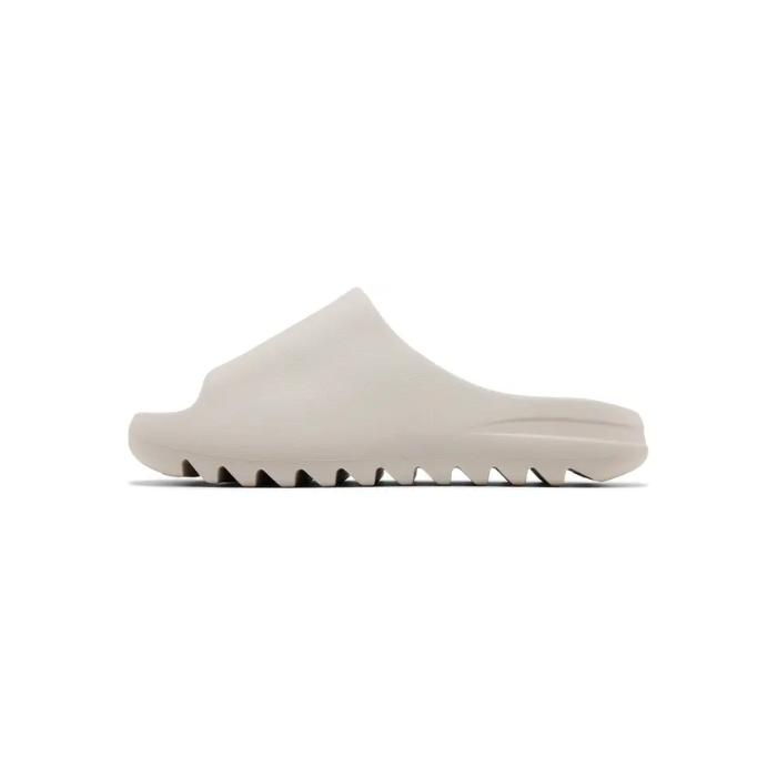 Cream Yeezy Slides with a unique sole design