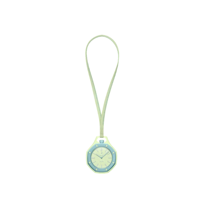 Small round clock with a green strap