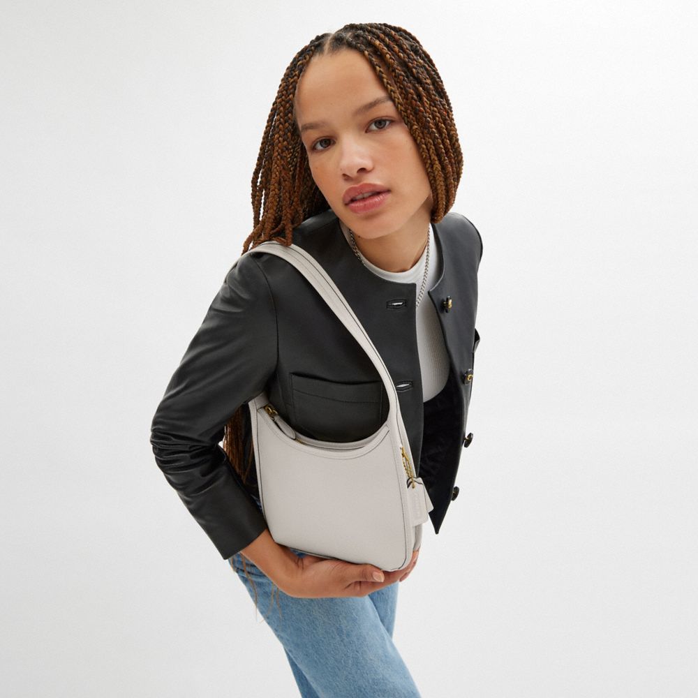 Coach Curve Zip Bag Brass Chalk
