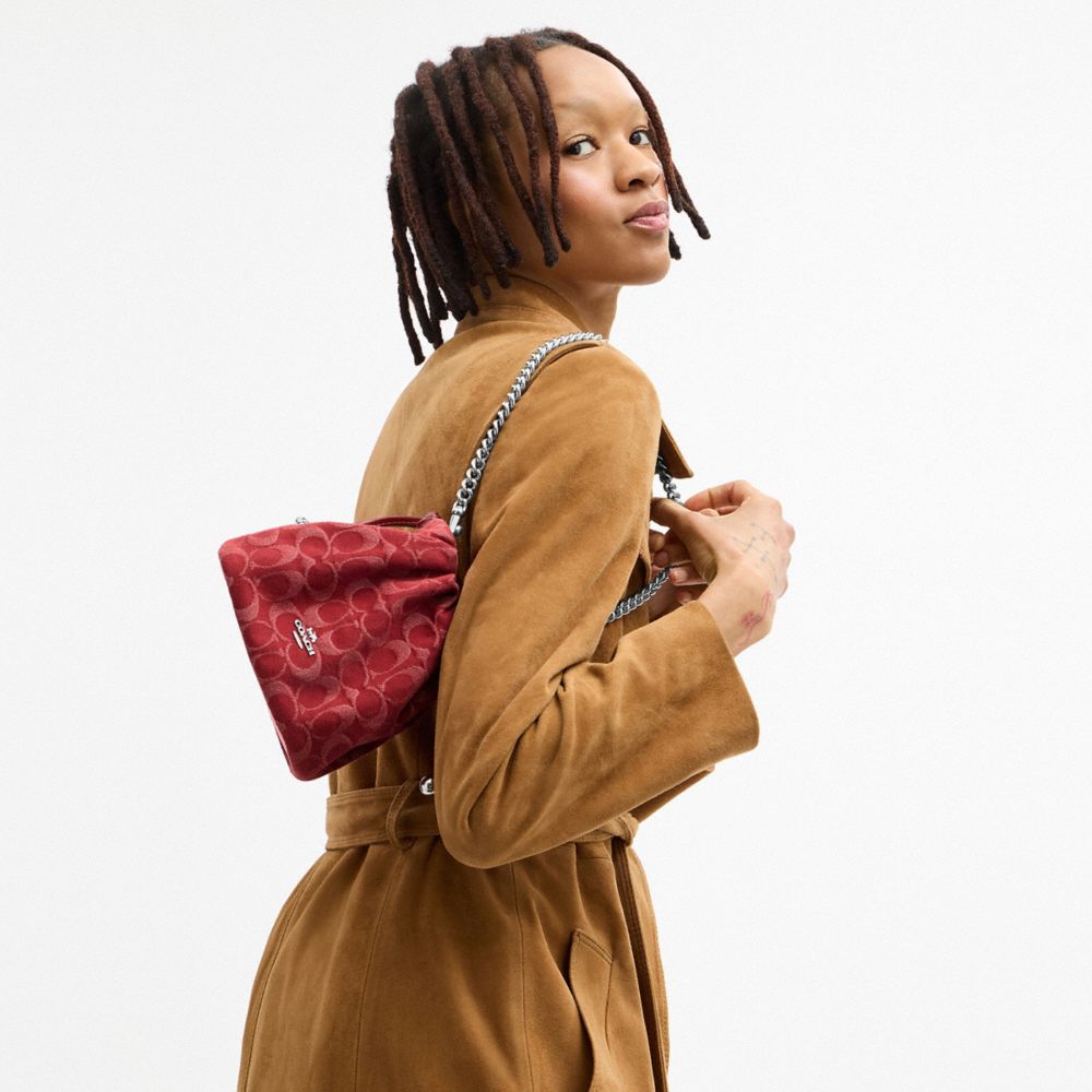 Coach Faye Mini Drawstring Bag In Signature Denim Silver True Red