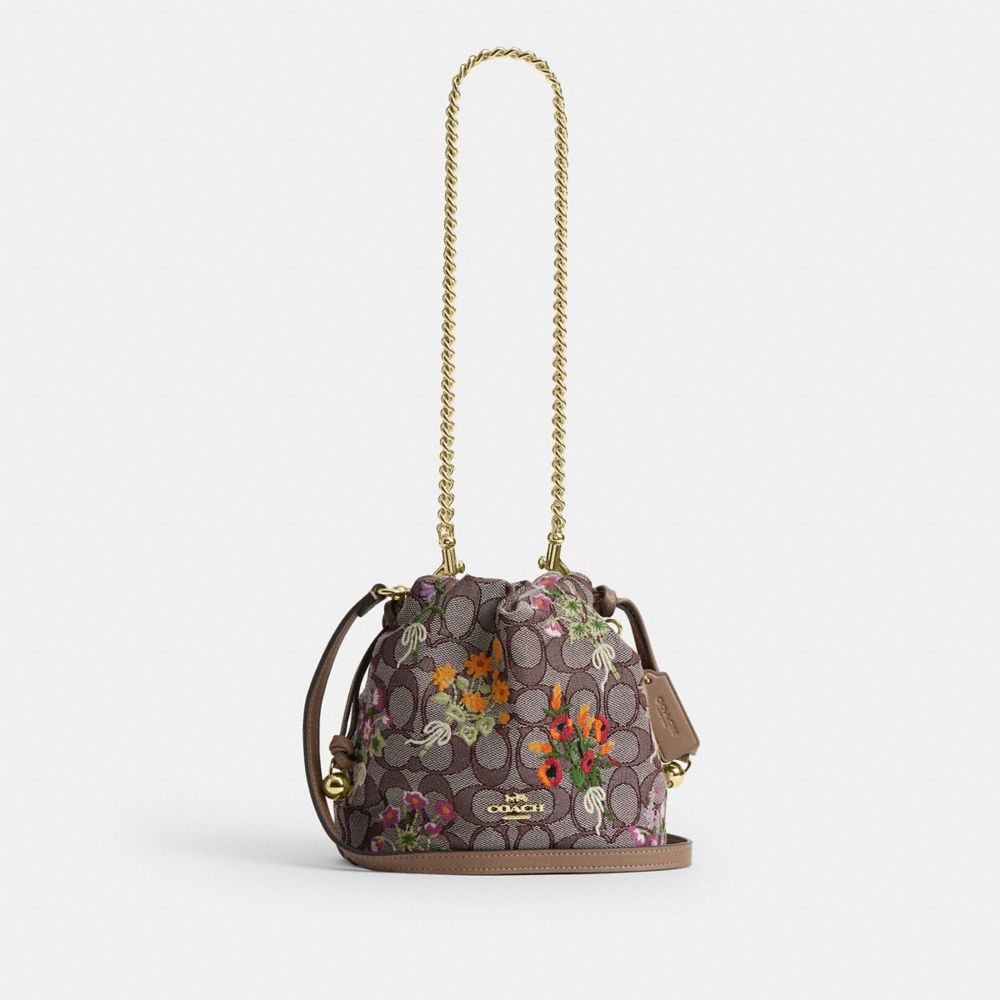Coach Faye Mini Drawstring Bag In Signature Jacquard With Floral Embroidery Gold Oak Multi