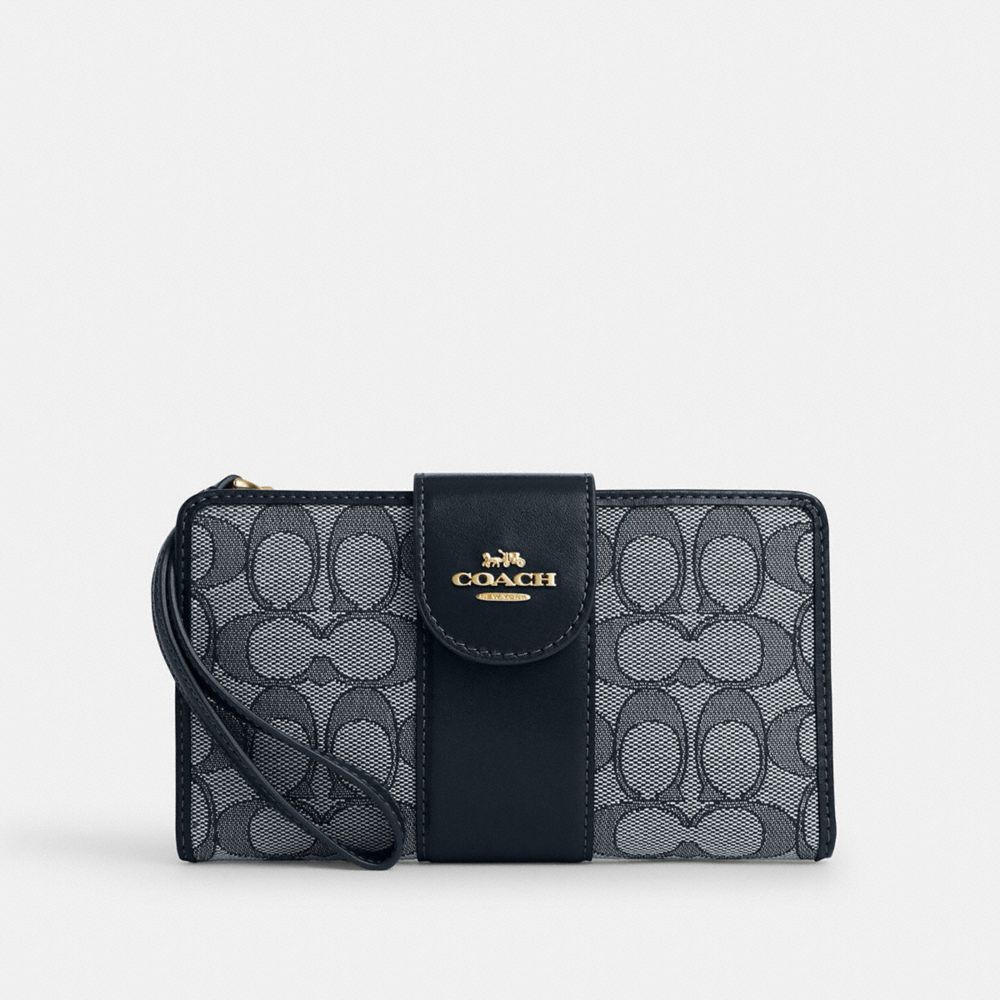 Coach Phone Wallet In Signature Jacquard Gold Navy Midnight Navy