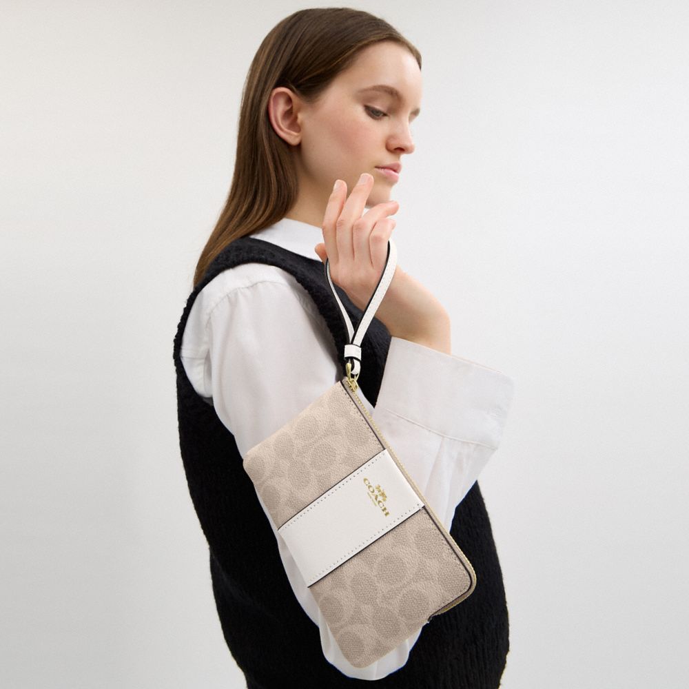 Coach Corner Zip Wristlet In Signature Canvas With Stripe Gold Sand Chalk