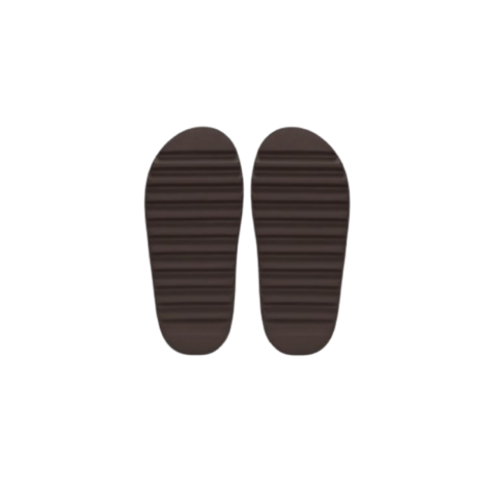 Pair of brown Yeezy Slides on striped insoles