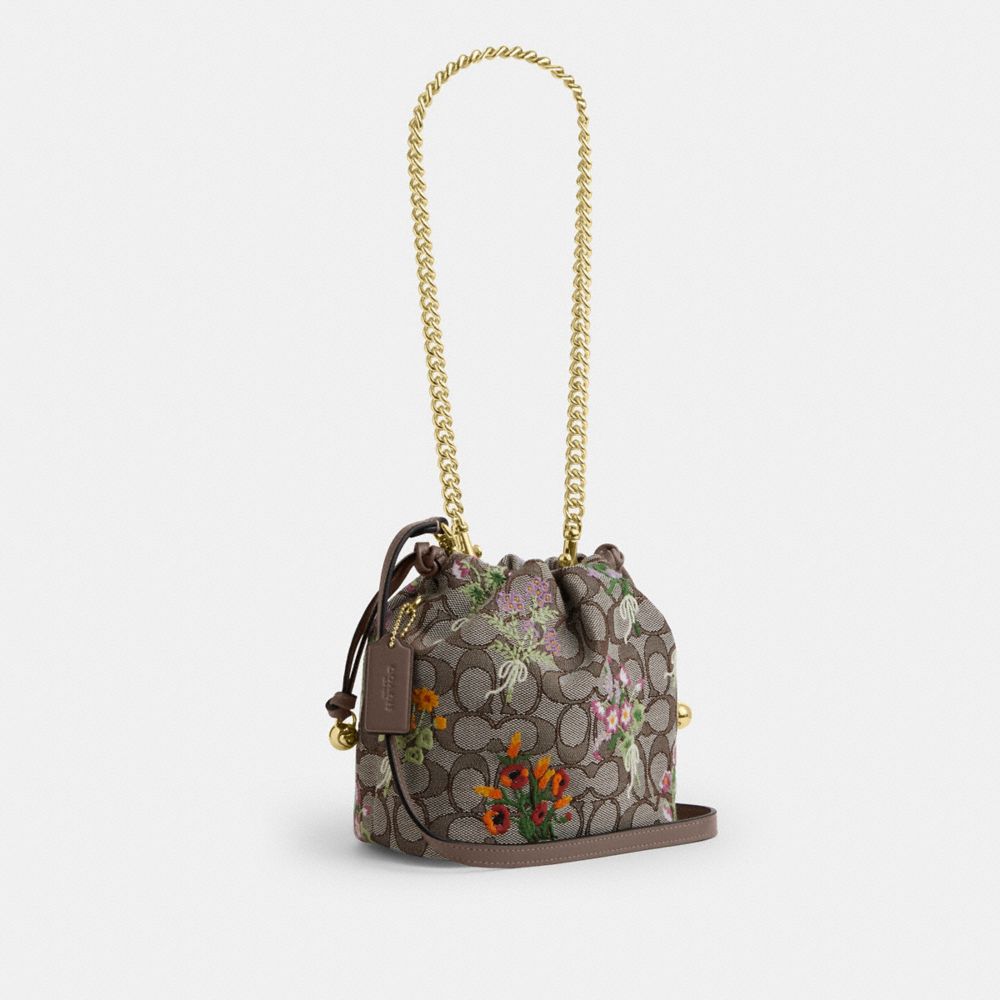 Coach Faye Mini Drawstring Bag In Signature Jacquard With Floral Embroidery Gold Oak Multi