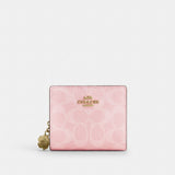 Coach Snap Wallet In Signature Canvas With Charm Gold Powder Pink