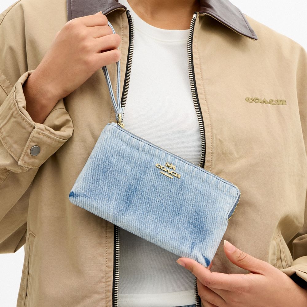 Coach Large Corner Zip Wristlet In Loved Denim Gold Light Indigo
