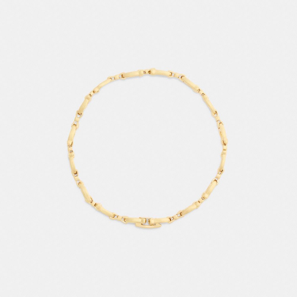 Coach Bow Chain Linear Bracelet Gold