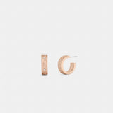 Coach Repeated C Huggie Earrings Rose Gold