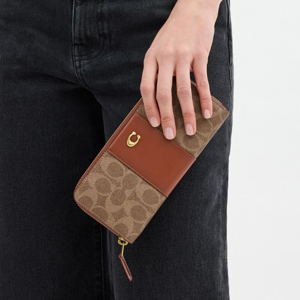 Coach Essential Slim Accordion Zip Wallet In Signature Canvas Brass Tan Caramel