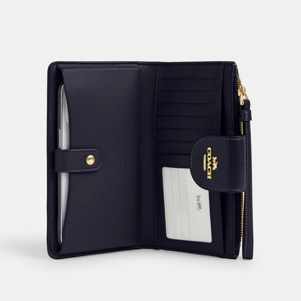 Coach Phone Wallet In Signature Jacquard Gold Navy Midnight Navy